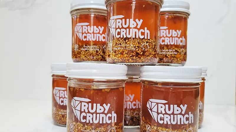 ruby crunch chili oil jars with custom clear labels