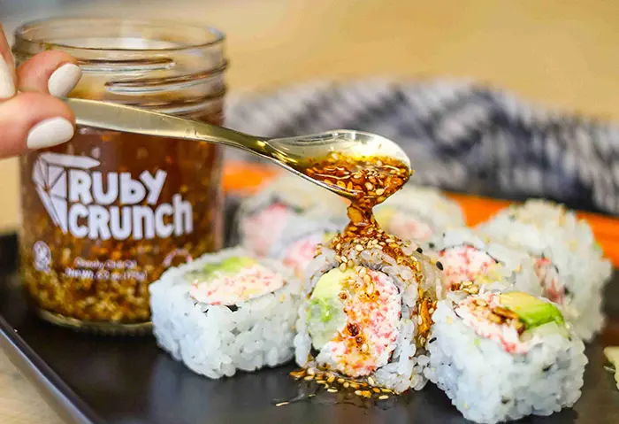 ruby crunch chili oil drizzling on sushi