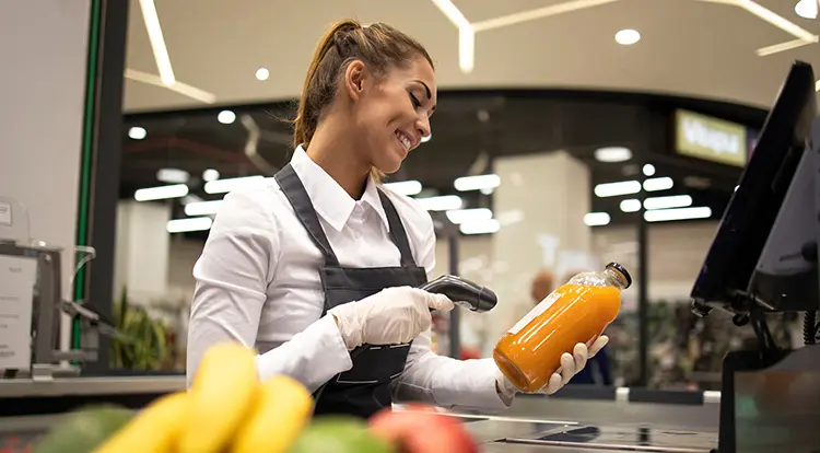 cashier scanning juice barcode label